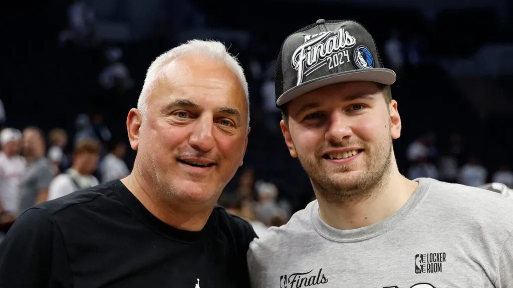  Luka Doncic #77 of the Dallas Mavericks celebrates with is father Sasa after a 124-103 victory against the Minnesota Timberwolves in Game Five