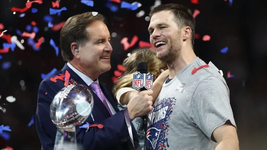 Jim Nantz (L) interviews Tom Brady #12 of the New England Patriots after the Patriots defeat the Los Angeles Rams 13-3 during Super Bowl LIII in 2019. (Source: Jamie Squire/Getty Images)