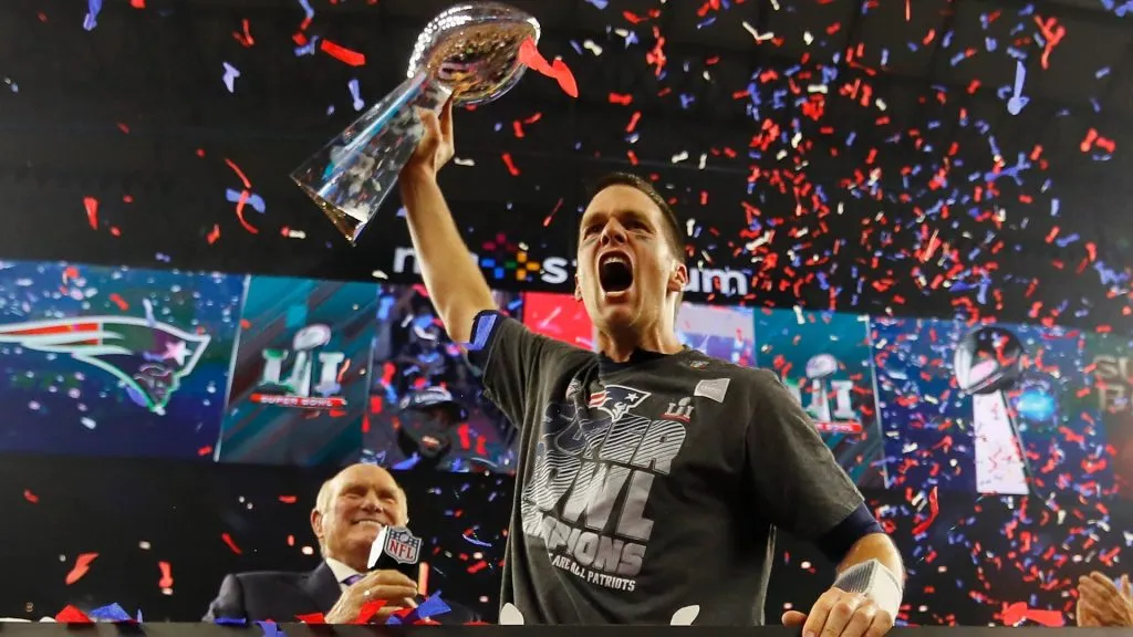 Tom Brady #12 of the New England Patriots raises the Vince Lombardi Trophy after defeating the Atlanta Falcons during Super Bowl 51 at NRG Stadium on February 5, 2017. (Source: Kevin C. Cox/Getty Images)