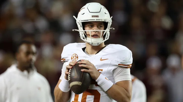 Arch Manning #16 of the Texas Longhorns warms up before the game against the Texas A&M Aggies at Kyle Field on November 30, 2024 in College Station, Texas.
