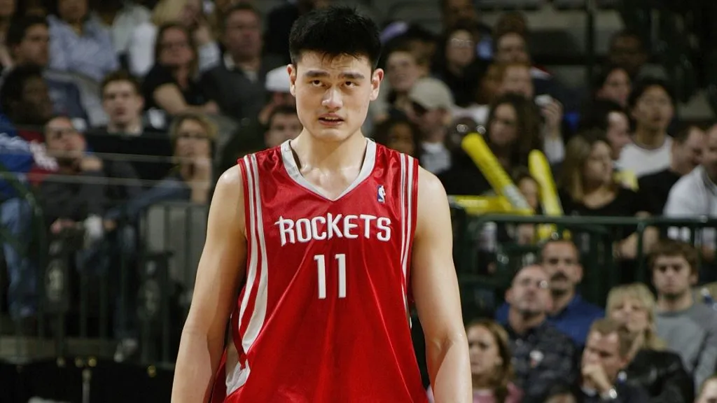 Yao Ming #11 of the Houston Rockets on the court during the game against the Dallas Mavericks on February 21, 2004. (Source: Ronald Martinez/Getty Images)