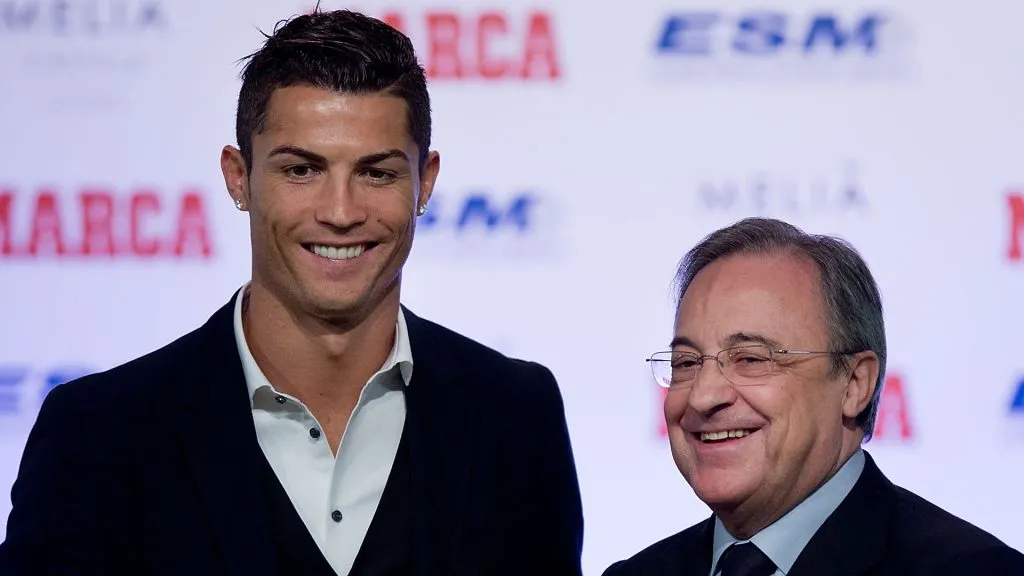 Cristiano Ronaldo (L) of Real Madrid CF receives the Golden Boot award from president of Real Madrid CF Florentino Perez (R