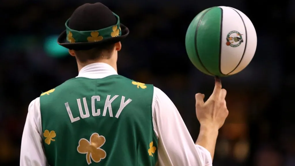 Boston Celtics mascot Lucky the Leprechaun spins a ball on his finger during a time out in the second half during a preseason game against the Brooklyn Nets in 2014. (Source: Mike Lawrie/Getty Images)