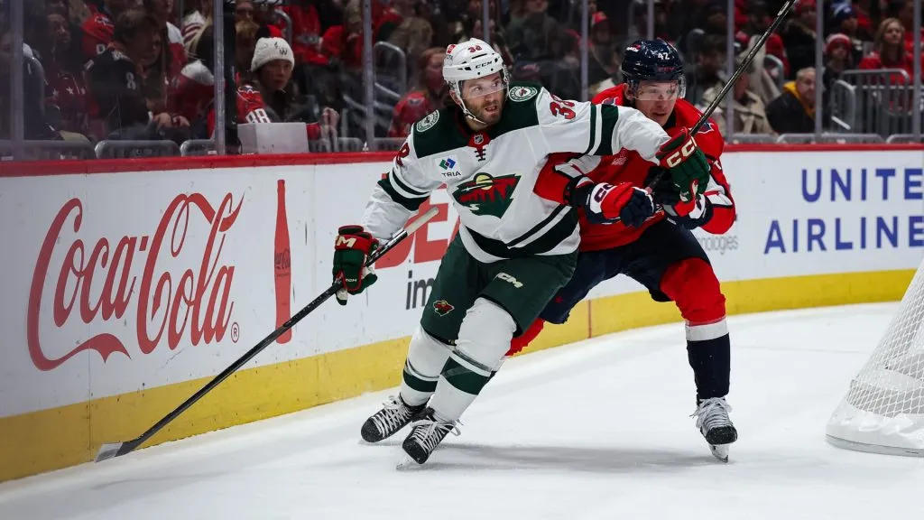 Ryan Hartman #38 of the Minnesota Wild and Martin Fehervary #42 of the Washington Capitals