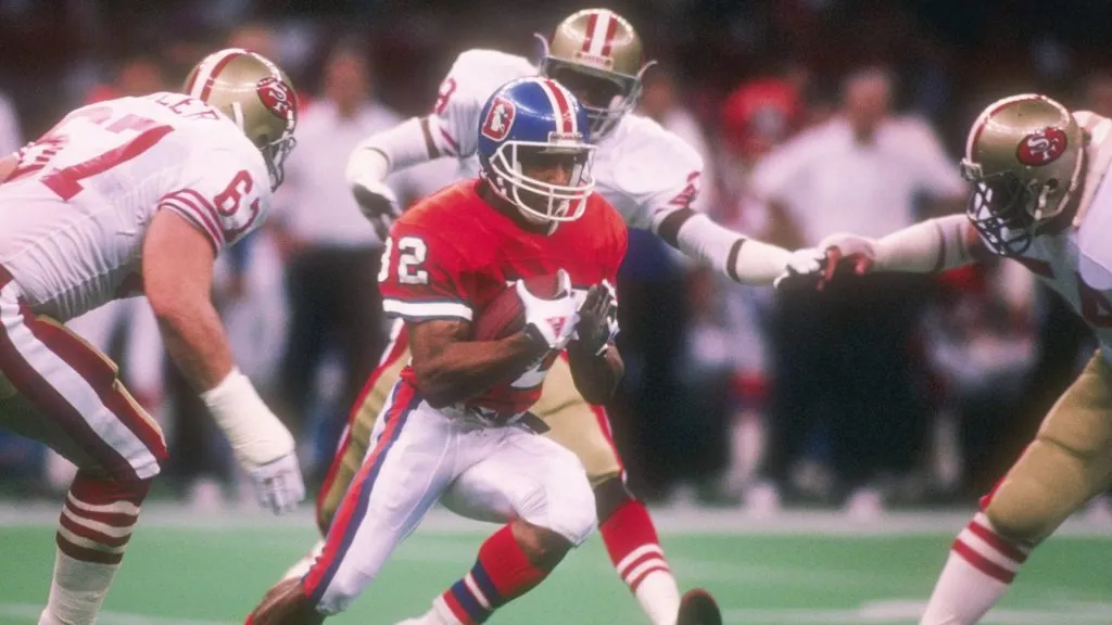 Wide receiver Vance Johnson #82 of the Denver Broncos is circled by the San Francisco defense during the Super Bowl XXIV in 1990. (Source: Rick Stewart)