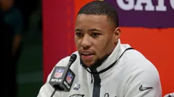 Philadelphia Eagles running back Saquon Barkley is surrounded by cameras on the field inside the Caesars Superdome during the Super Bowl Opening Night on February 3, 2025 in New Orleans, Louisiana. The Philadelphia Eagles and Kansas City Chiefs were made available for interviews during an energetic, New Orleans-themed event ahead of next Sunday's Super Bowl LIX.