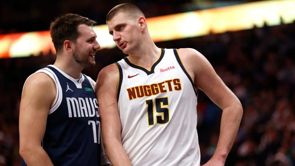 Luka Doncic #77 of the Dallas Mavericks and Nikola Jokic #15 of the Denver Nuggets talk during a beak in the action in the second half at American Airlines Center. (Ron Jenkins/Getty Images)