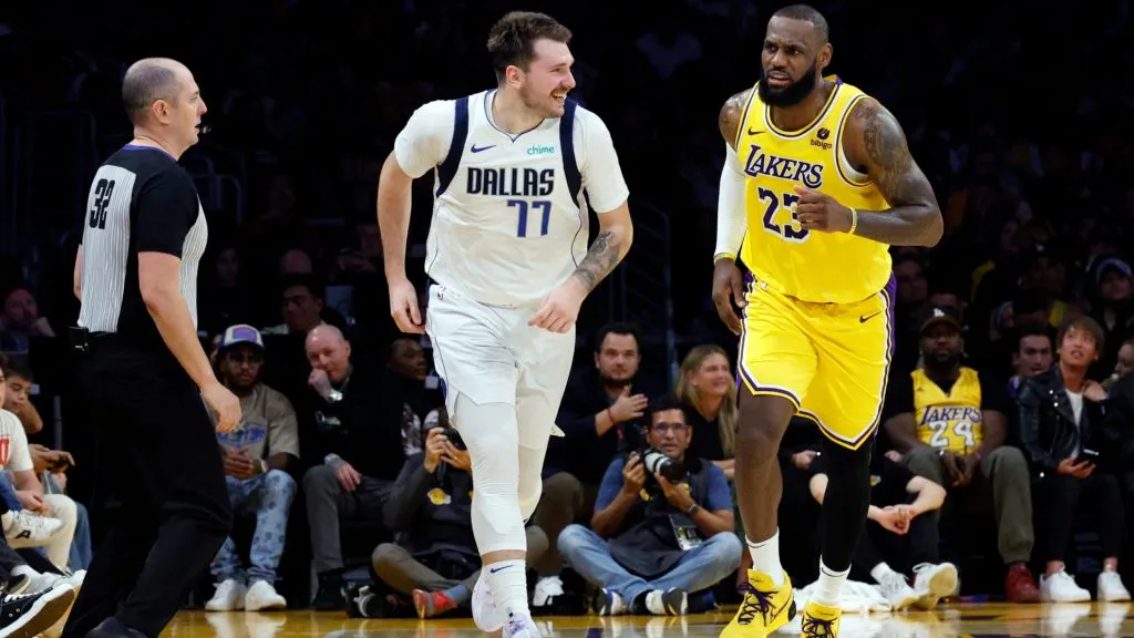 Luka Doncic #77 of the Dallas Mavericks reacts after scoring a basket against LeBron James #23 of the Los Angeles Lakers during the second half at Crypto.com Arena. (Kevork Djansezian/Getty Images)