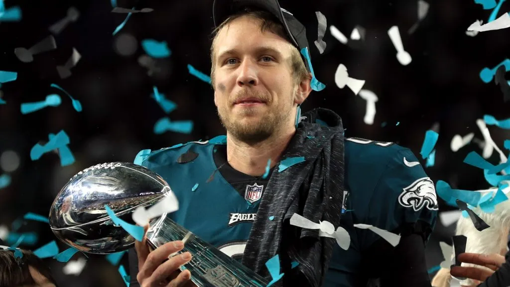 Nick Foles #9 of the Philadelphia Eagles celebrates with the Lombardi Trophy after defeating the New England Patriots 41-33 in Super Bowl LII. (Source: Mike Ehrmann/Getty Images)