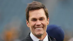 Tom Brady looks on from the field prior to an NFL football game between the Pittsburgh Steelers and the Philadelphia Eagles at Lincoln Financial Field on December 15, 2024 in Philadelphia, Pennsylvania.