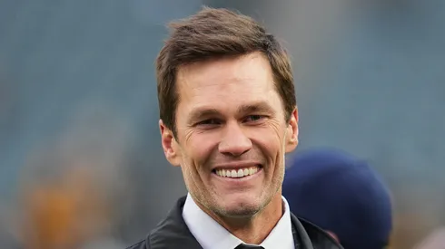 Tom Brady looks on from the field prior to an NFL football game between the Pittsburgh Steelers and the Philadelphia Eagles at Lincoln Financial Field on December 15, 2024 in Philadelphia, Pennsylvania.