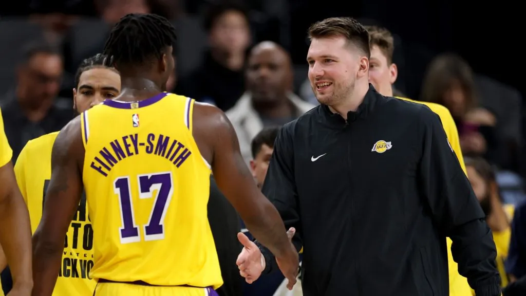 Luka Doncic #77 of the Los Angeles Lakers celebrates a lead with Dorian Finney-Smith #17 during a 122-97 Lakers win over the LA Clippersat Intuit Dome. (Harry How/Getty Images)