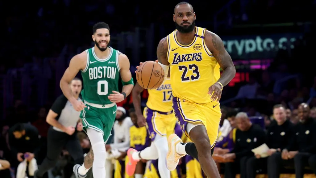 LeBron James #23 of the Los Angeles Lakers dribbles away from Jayson Tatum #0 of the Boston Celtics during a 117-96 Lakers win at Crypto.com Arena. (Harry How/Getty Images)