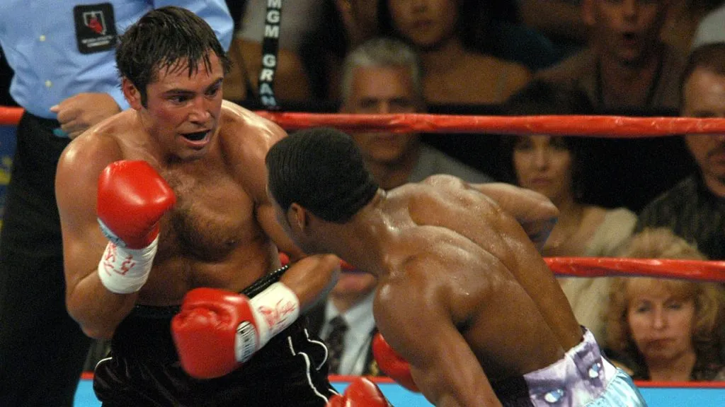 Shane Mosley lands a blow to the body of Oscar De La Hoya. (Photo by Steve Grayson/WireImage)