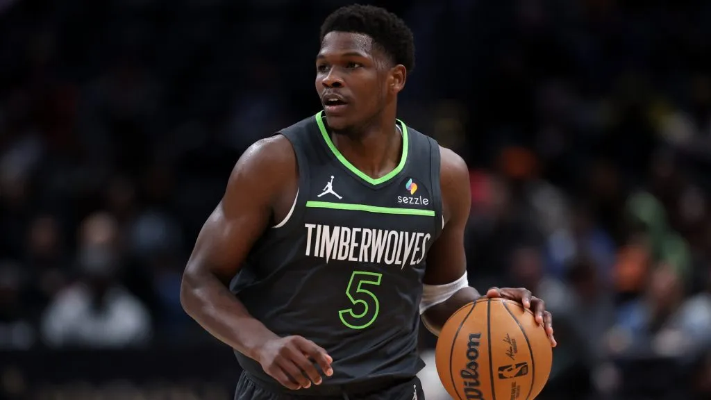 Anthony Edwards #5 of the Minnesota Timberwolves dribbles the ball up the court against the Washington Wizards.