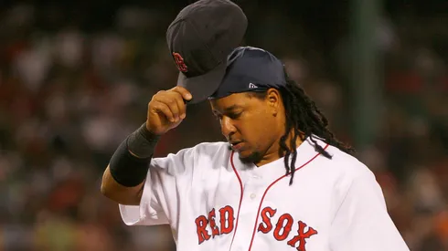 Manny Ramirez #24 of the Boston Red Sox removes his cap as he walks off of the field against the Los Angeles Angels of Anaheim at Fenway Park on July 30, 2008 in Boston, Massachusetts.