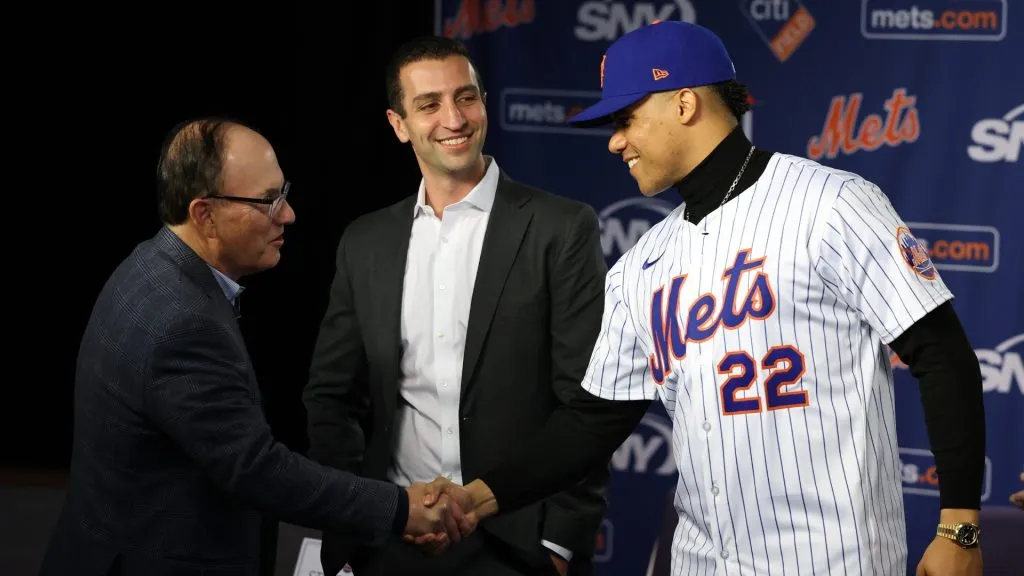 Steve Cohen, Owner of the New York Mets shakes hands with Juan Soto as David Stearns, the president of baseball operations watches during his introductory press conference at Citi Field on December 12, 2024 in New York City. (Photo by Al Bello/Getty Images)