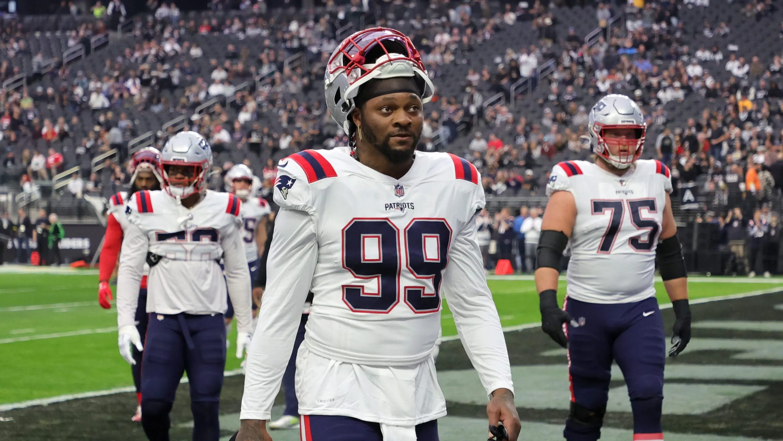 LAS VEGAS, NEVADA – DECEMBER 18: Linebacker Jamie Collins Sr. #99 and offensive tackle Conor McDermott #75 of the New England Patriots walk off the field after warmups before a game against the Las Vegas Raiders at Allegiant Stadium on December 18, 2022 in Las Vegas, Nevada. The Raiders defeated the Patriots 30-24. (Photo by Ethan Miller/Getty Images)