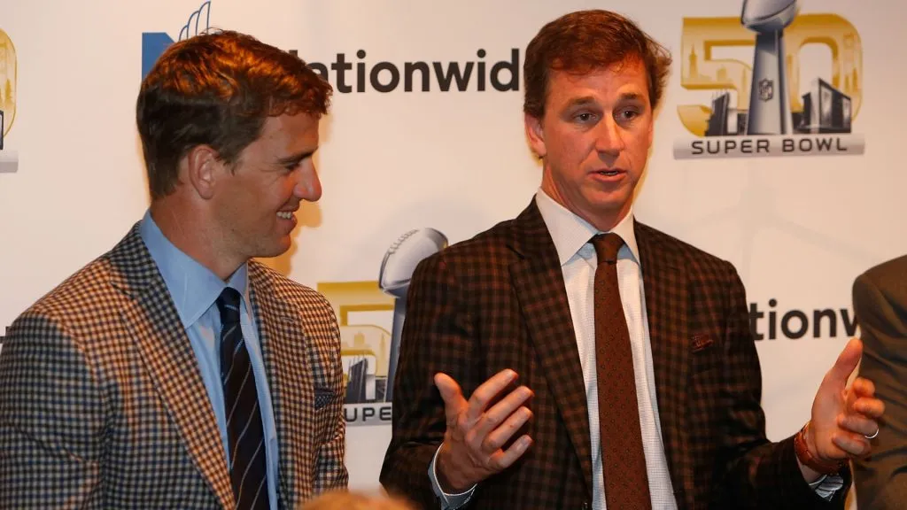 Eli Manning (left) and Cooper Manning address guests during a Nationwide dinner at Morton’s The Steakhouse on February 5, 2016. (Source: Lachlan Cunningham/Getty Images for Nationwide)