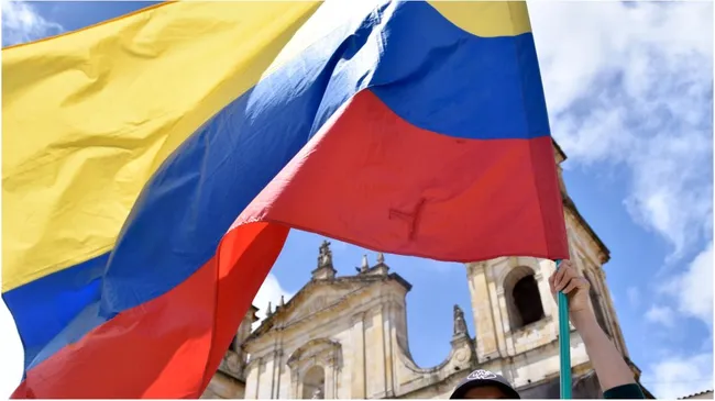 Fan holds a Colombian flag – Guillermo Legaria/Getty Images
