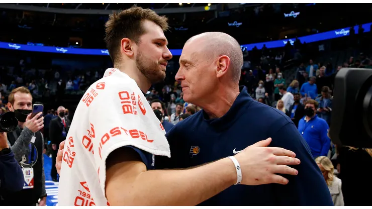 Luka Doncic #77 of the Dallas Mavericks hugs Rick Carlisle head coach of the Indiana Pacers after the game at American Airlines Center on January 29, 2022 in Dallas, Texas.