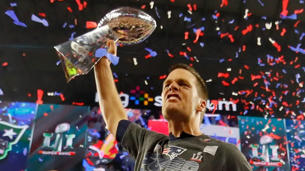 Tom Brady #12 of the New England Patriots celebrates with the Vince Lombardi Trophy after defeating the Atlanta Falcons during Super Bowl 51 at NRG Stadium on February 5, 2017 in Houston, Texas. The Patriots defeated the Falcons 34-28.