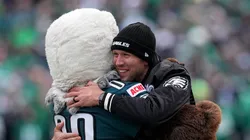 Former quarterback Nick Foles hugs the Philadelphia Eagles mascot prior to the NFC Championship Game against the Washington Commanders at Lincoln Financial Field on January 26, 2025 in Philadelphia, Pennsylvania.