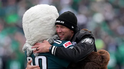 Former quarterback Nick Foles hugs the Philadelphia Eagles mascot prior to the NFC Championship Game against the Washington Commanders at Lincoln Financial Field on January 26, 2025 in Philadelphia, Pennsylvania.