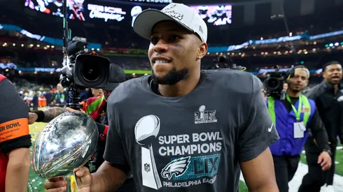 Saquon Barkley #26 of the Philadelphia Eagles celebrates with the Vince Lombardi Trophy after beating the Kansas City Chiefs 40-22 to win Super Bowl LIX at Caesars Superdome on February 09, 2025 in New Orleans, Louisiana.