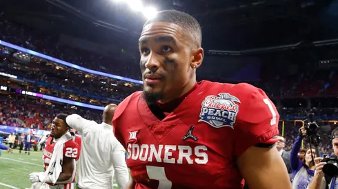 Quarterback Jalen Hurts #1 of the Oklahoma Sooners walks off the field after the LSU Tigers win the Chick-fil-A Peach Bowl 28-63 at Mercedes-Benz Stadium on December 28, 2019 in Atlanta, Georgia.