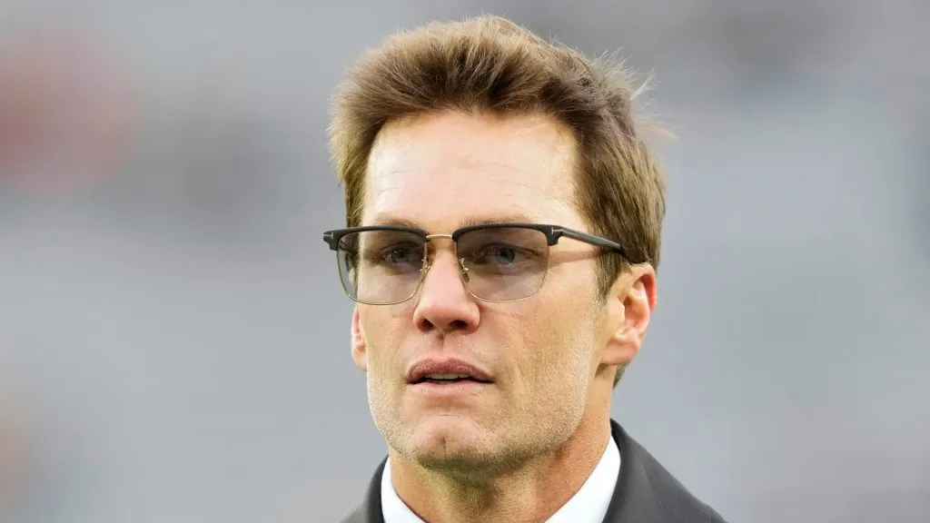 Tom Brady walks across the field before the game between the San Francisco 49ers and the Green Bay Packers at Lambeau Field on November 24, 2024 in Green Bay, Wisconsin.