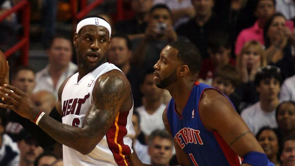 Forward LeBron James #6 of the Miami Heat takes on guard Tracy McGrady #1 of the Detroit Pistons