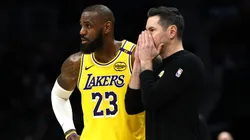 JJ Redick and LeBron James of the Los Angeles Lakers speak during a game against the Charlotte Hornets on January 27, 2025.