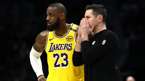 JJ Redick and LeBron James of the Los Angeles Lakers speak during a game against the Charlotte Hornets on January 27, 2025.