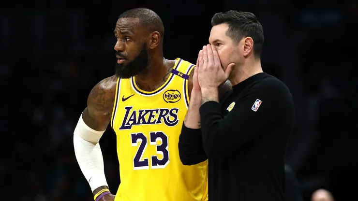 JJ Redick and LeBron James of the Los Angeles Lakers speak during a game against the Charlotte Hornets on January 27, 2025.
