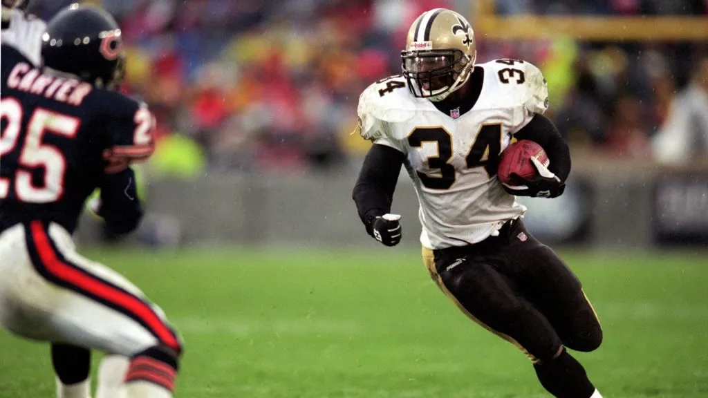 Ricky Williams #34 of the New Orleans Saints runs with the ball during the game against the Chicago Bears in 1999. (Source: Harry How /Allsport)