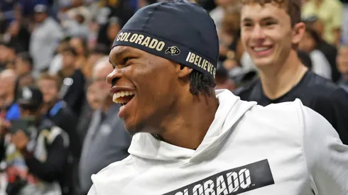 Travis Hunter #12 of the Colorado Buffaloes is all smiles after catching passes for fans before the game against the BYU Cougars in the Valero Alamo Bowl at Alamodome on December 28, 2024 in San Antonio, Texas.