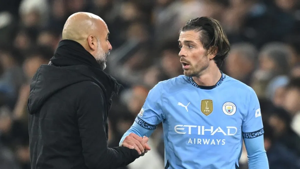 Jack Grealish and Pep Guardiola talk after the winger was subbed off against Real Madrid (&nbsp;Michael Regan/Getty Images)