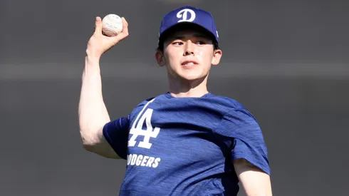 Roki Sasaki #11 of the Los Angeles Dodgers throws during workouts at Camelback Ranch on February 11, 2025 in Glendale, Arizona.