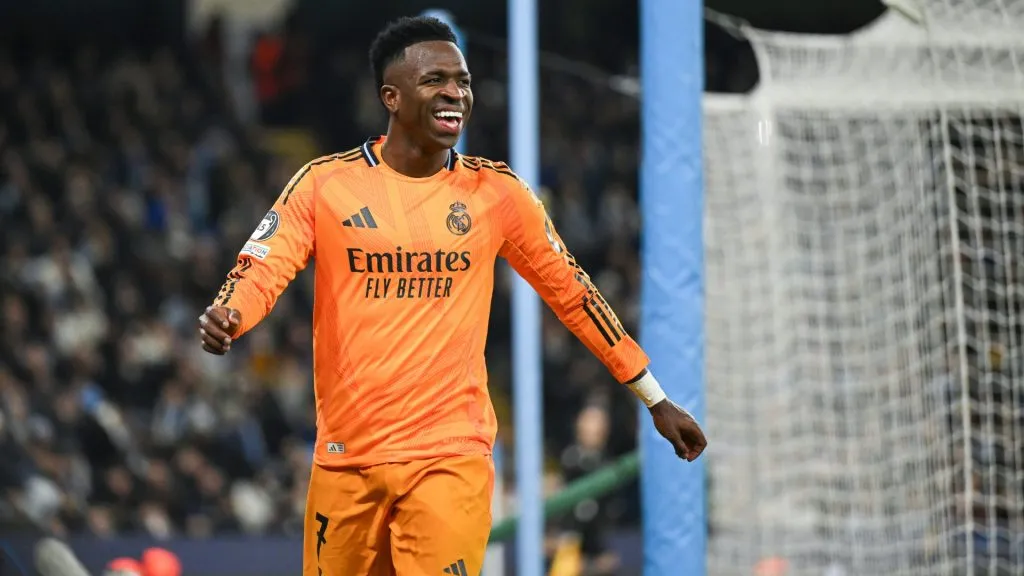 Vinicius Junior of Real Madrid laughs during the UEFA Champions League 2024/25 League Knockout Play-off first leg match between Manchester City and Real Madrid C.F. in 2025. (Source: Michael Regan/Getty Images)