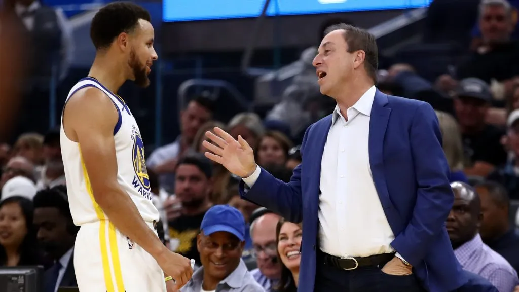 Golden State Warriors owner Joe Lacob speaks to Stephen Curry #30 during their game against the Los Angeles Lakers at Chase Center on October 05, 2019. (Source: Ezra Shaw/Getty Images)