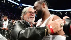 Dwyane Wade #3 of the Miami Heat hugs Miami Heat owner Micky Arison after the game against the Brooklyn Nets at Barclays Center on April 10, 2019.