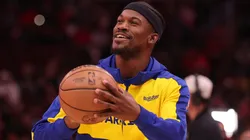 immy Butler #10 warms up prior to his debut with the Golden State Warriors against the Chicago Bulls