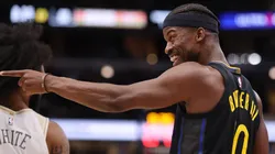Jimmy Butler wearing the Golden State Warriors' #10 jersey.