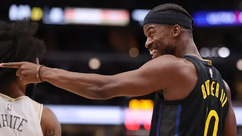 Jimmy Butler wearing the Golden State Warriors' #10 jersey.