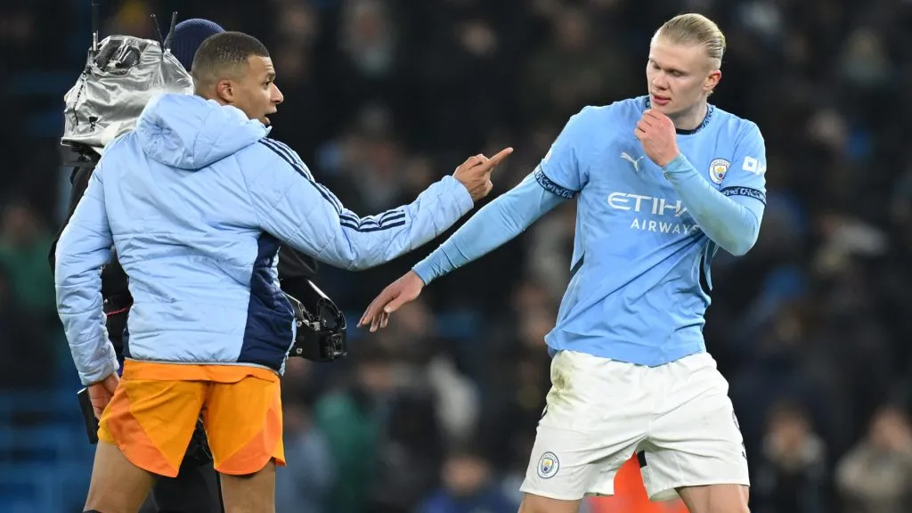 Kylian Mbappe of Real Madrid speaks with Erling Haaland of Manchester City a UEFA Champions League match. (Michael Regan/Getty Images)