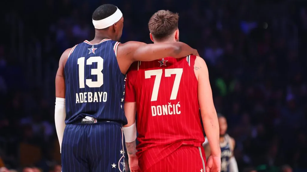 Bam Adebayo and Luka Doncic embrace on the court in the third quarter during the 2024 NBA All-Star Game. (Source: Stacy Revere/Getty Images)