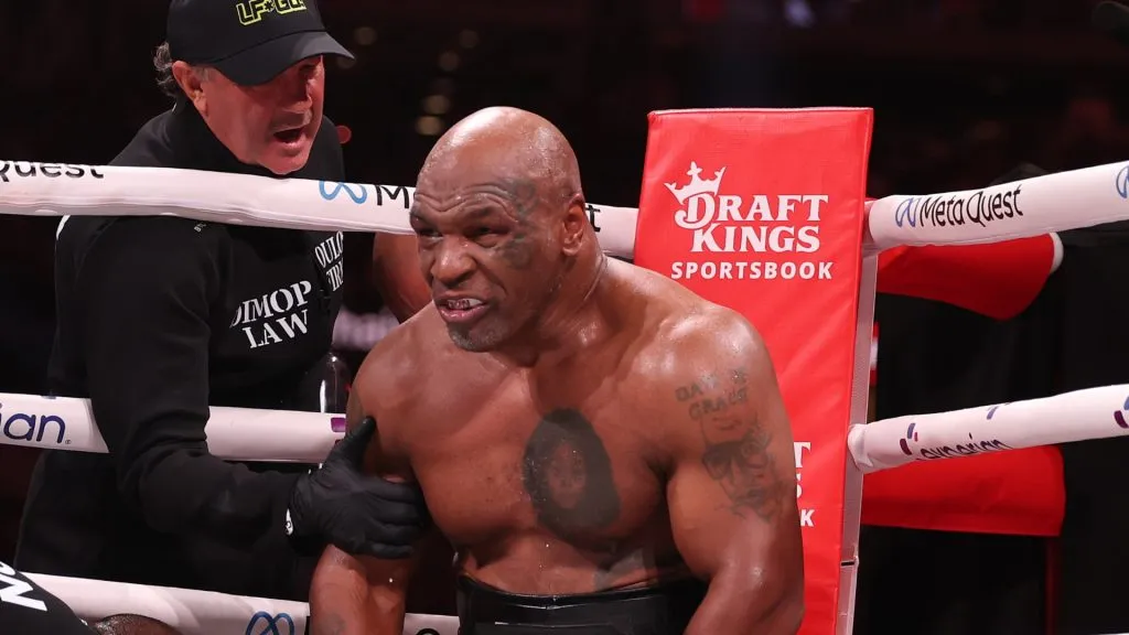 Mike Tyson sits in his corner between rounds against Jake Paul during LIVE On Netflix: Jake Paul vs. Mike Tyson at AT&T Stadium on November 15, 2024 in Arlington, Texas. (Photo by Al Bello/Getty Images for Netflix © 2024)