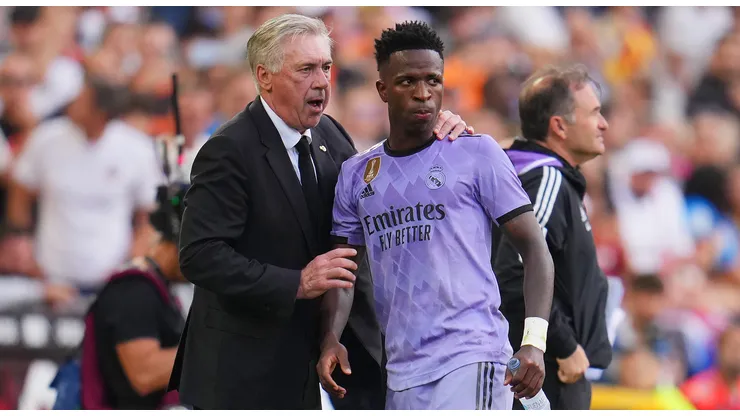 Carlo Ancelotti, Head Coach of Real Madrid, interacts with Vinicius Junior of Real Madrid during the LaLiga Santander match between Valencia CF and Real Madrid CF at Estadio Mestalla on May 21, 2023 in Valencia, Spain.