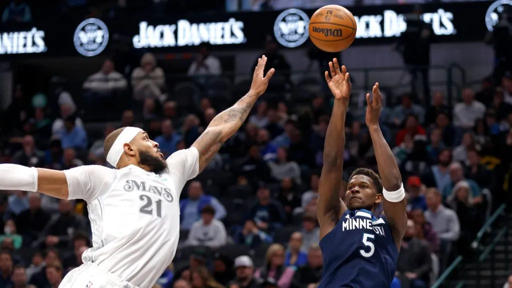 Anthony Edwards #5 of the Minnesota Timberwolves shoots from the three-point line against Daniel Gafford #21 of the Dallas Mavericks. (Ron Jenkins/Getty Images)